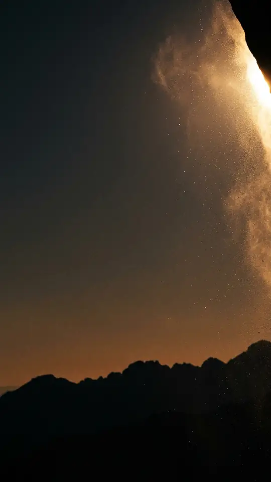 A brand card held still over hanging dust at dusk